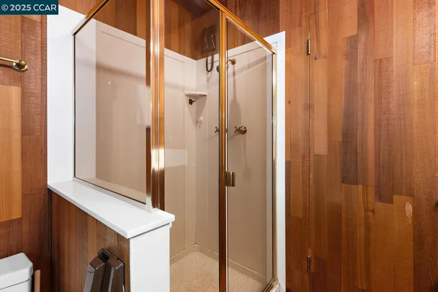 a bathroom with a sink a mirror and a shower