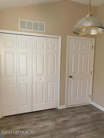 a view of entryway with wooden floor