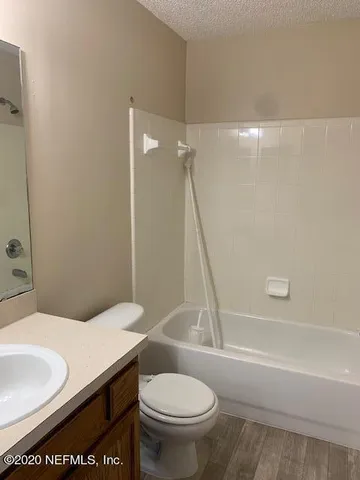 a bathroom with a sink a toilet and a bathtub