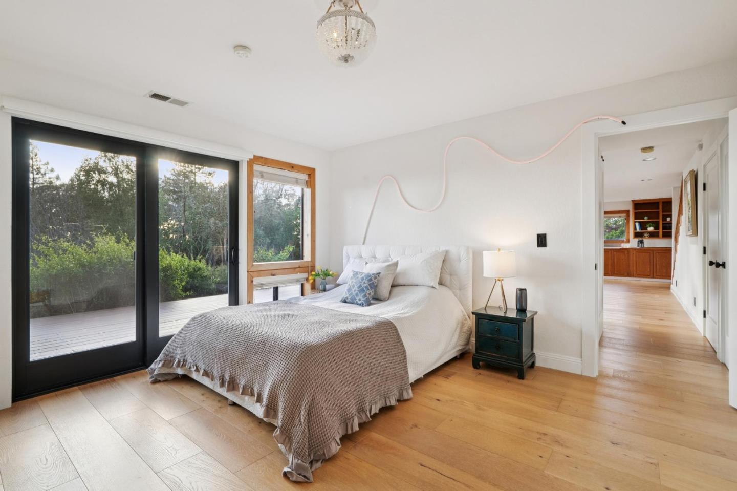 600 Ridge Top Road Los Gatos, CA 95033 - Photo 55 of 81 a bedroom with a bed and glass door