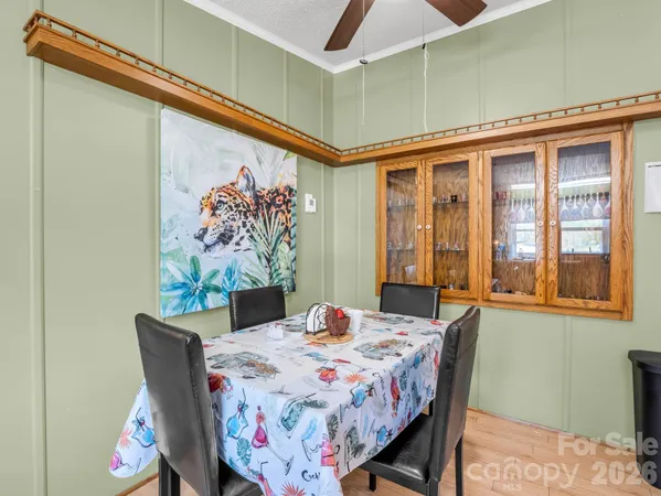 a dining room with a table and chairs