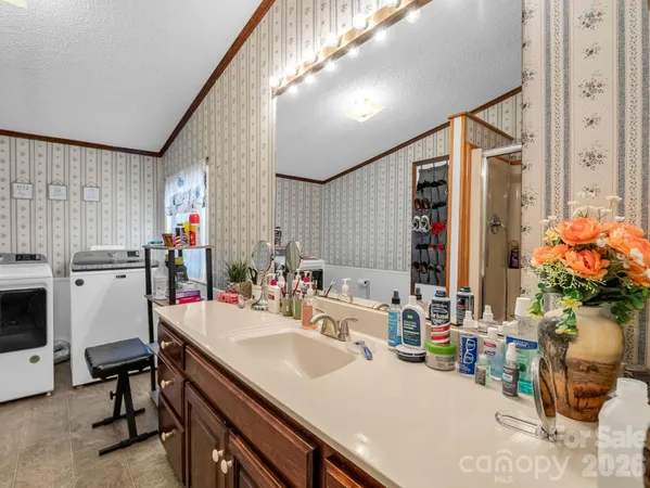 a bathroom with a sink double vanity and a mirror
