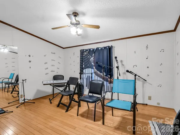 a workspace room with furniture and wooden floor