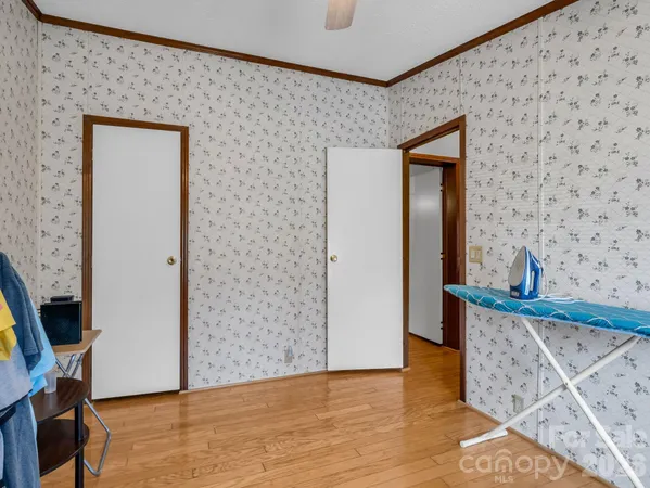 a view of an entryway with wooden floor