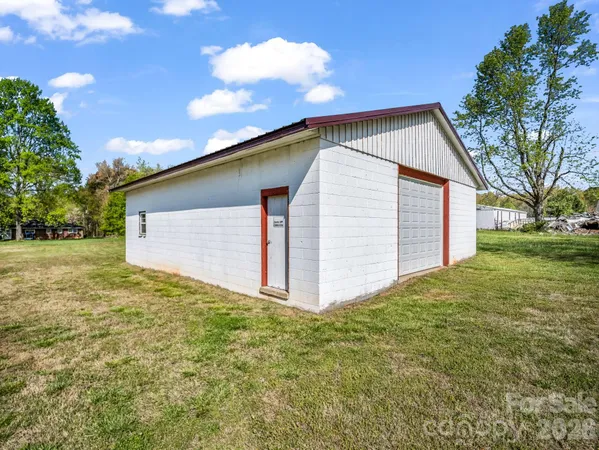 a view of a backyard of the house