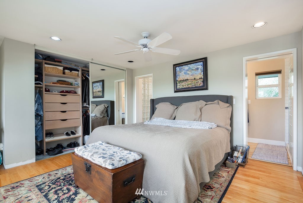 4044 East Mercer Way Mercer Island, WA 98040 - Photo 16 of 37 a bedroom with a bed and a table