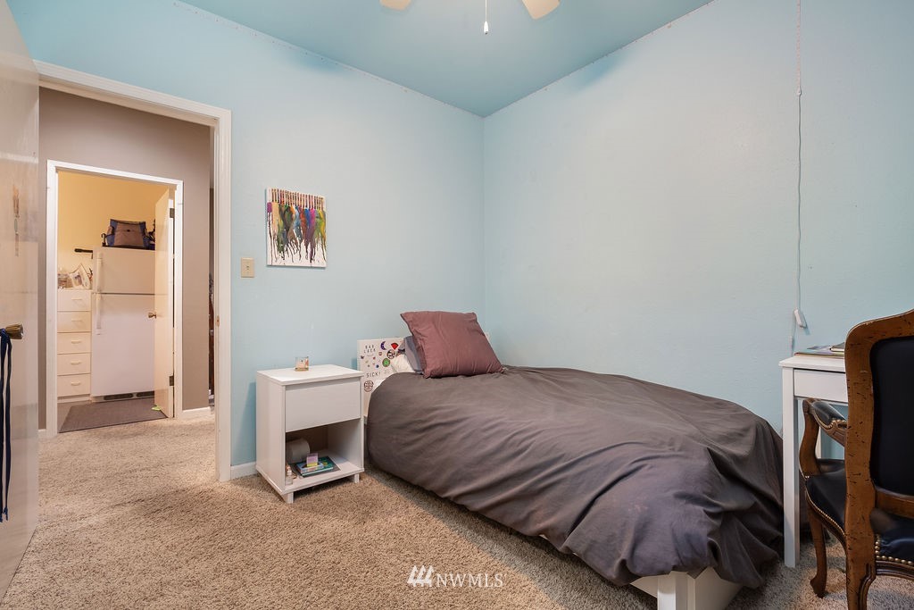 4044 East Mercer Way Mercer Island, WA 98040 - Photo 19 of 37 a bedroom with a bed and a chair