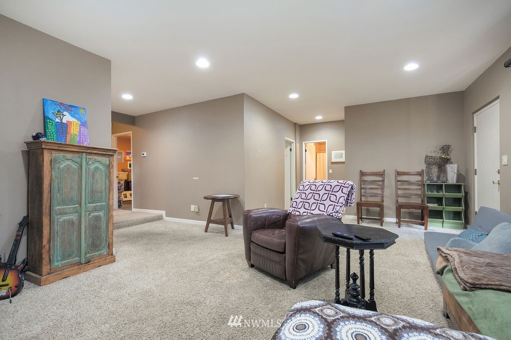 4044 East Mercer Way Mercer Island, WA 98040 - Photo 22 of 37 a living room with furniture and a flat screen tv