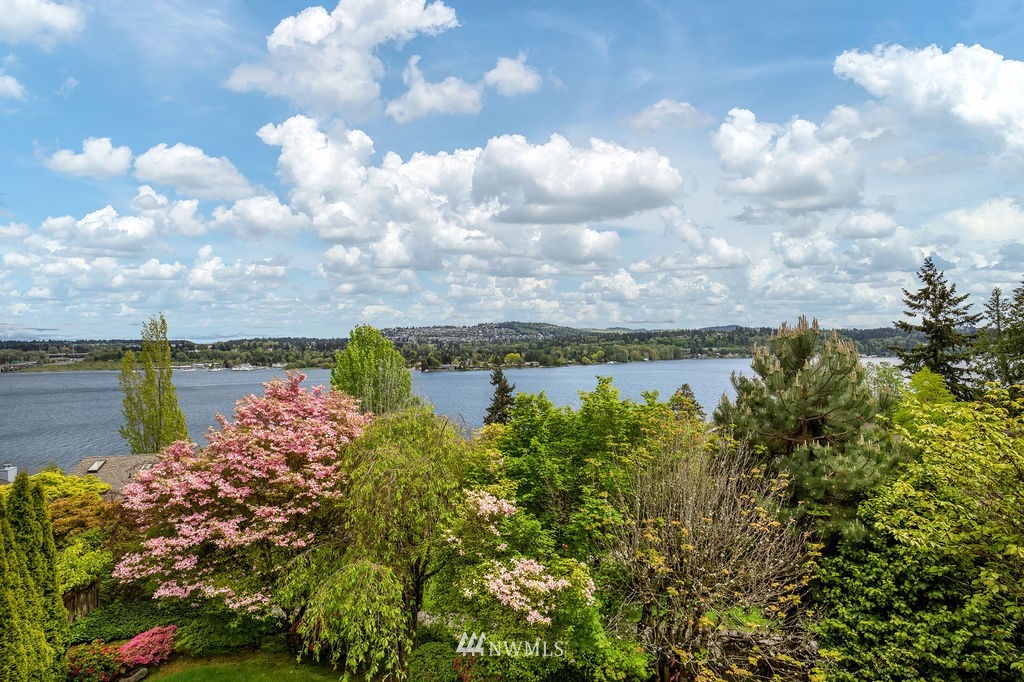 4044 East Mercer Way Mercer Island, WA 98040 - Photo 27 of 37 a view of a lake with a building in the background