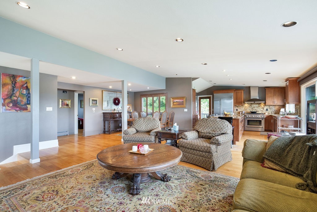 4044 East Mercer Way Mercer Island, WA 98040 - Photo 7 of 37 a living room with furniture and a table
