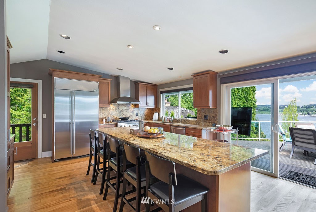 4044 East Mercer Way Mercer Island, WA 98040 - Photo 9 of 37 a view of a dining room with furniture window and outside view