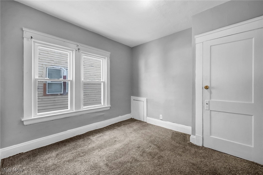 1854 Grantham Road Cleveland, OH 44112 - Photo 38 of 47 Carpeted spare room featuring baseboards