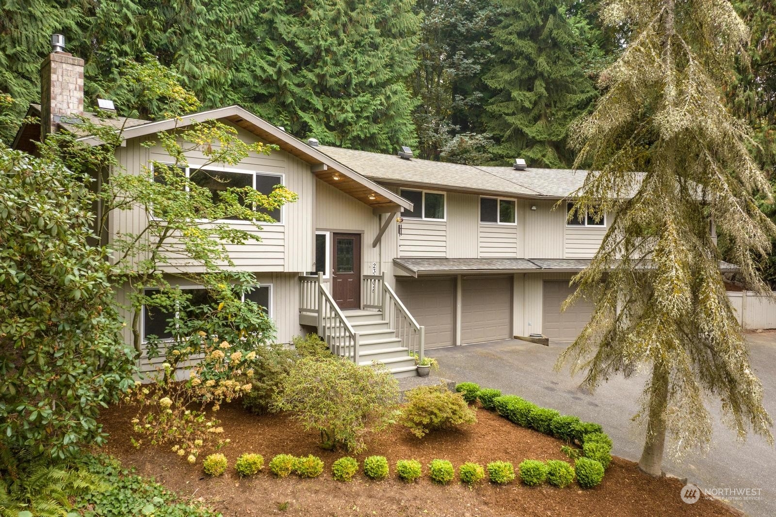 23002 2nd Avenue Southeast Bothell, WA 98021 - Photo 1 of 22 a front view of a house with a garden