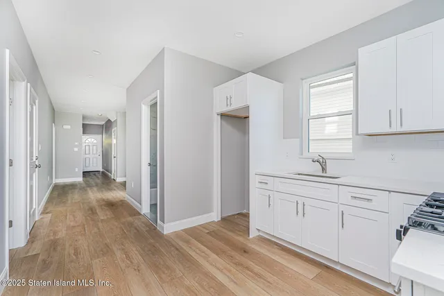a view of a kitchen from the hallway