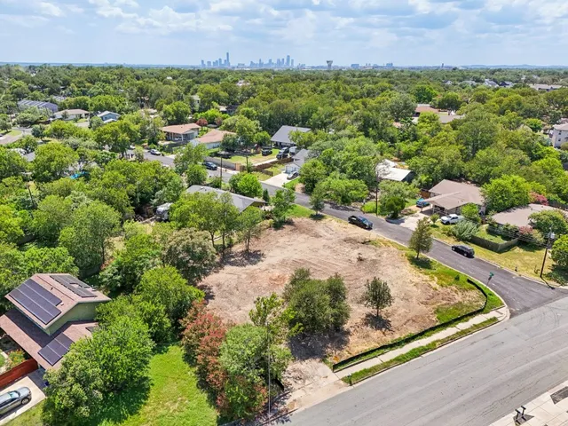 an aerial view of a house with a garden