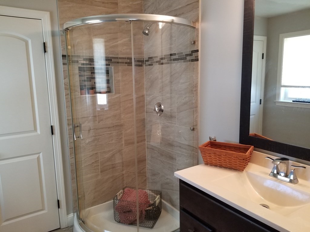 428 Smith Fall River Fall River, MA 02721 - Photo 11 of 31 a bathroom with a sink a toilet and shower