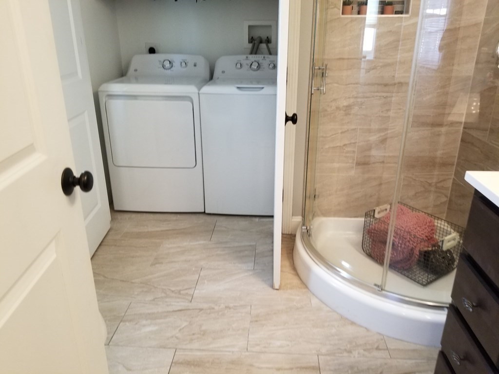 428 Smith Fall River Fall River, MA 02721 - Photo 12 of 31 a bathroom with a sink a toilet and shower