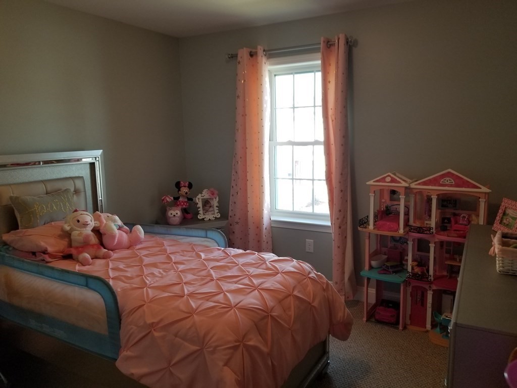 428 Smith Fall River Fall River, MA 02721 - Photo 16 of 31 a bedroom with a bed and a window