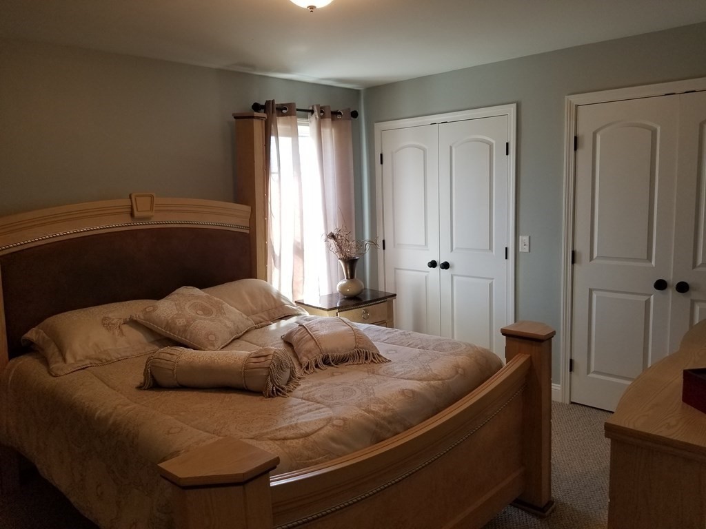 428 Smith Fall River Fall River, MA 02721 - Photo 18 of 31 a bedroom with a bed and window