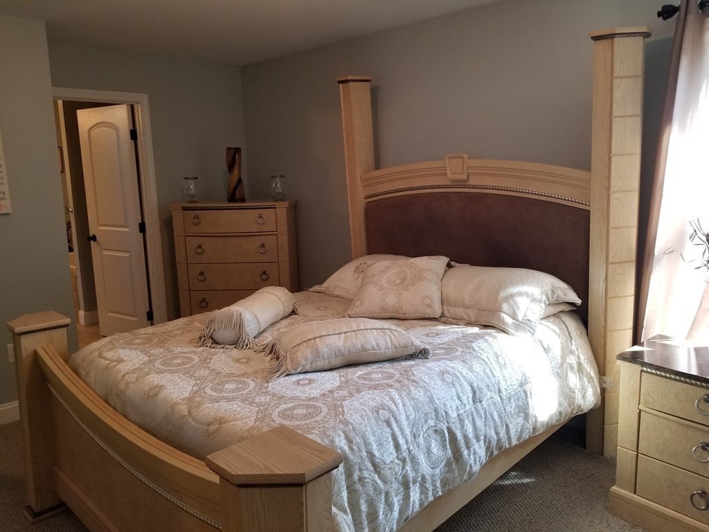 428 Smith Fall River Fall River, MA 02721 - Photo 19 of 31 a bedroom with a bed and cabinet