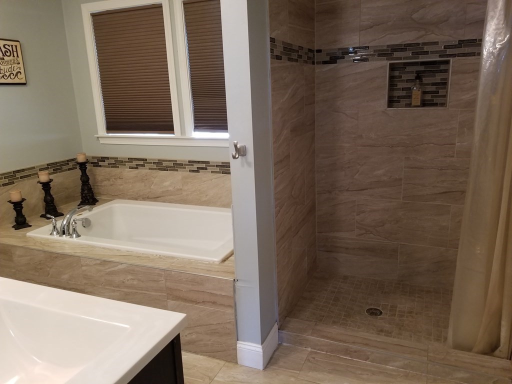 428 Smith Fall River Fall River, MA 02721 - Photo 21 of 31 a bathroom with a bathtub and shower
