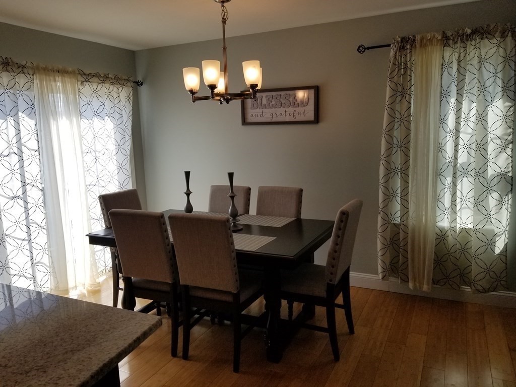 428 Smith Fall River Fall River, MA 02721 - Photo 5 of 31 a view of a dining room with furniture window and wooden floor