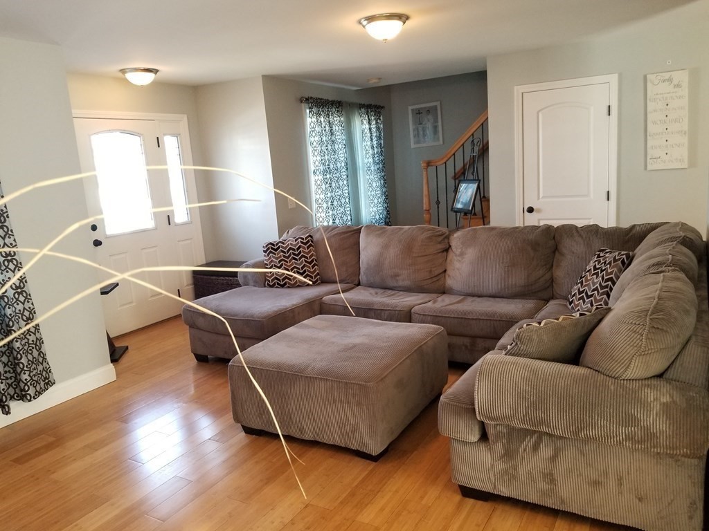 428 Smith Fall River Fall River, MA 02721 - Photo 7 of 31 a living room with furniture and wooden floor