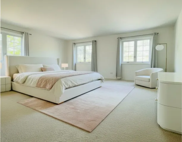 a bedroom with a large bed and a couch