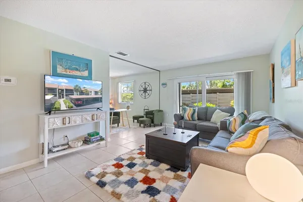 a living room with furniture and a rug