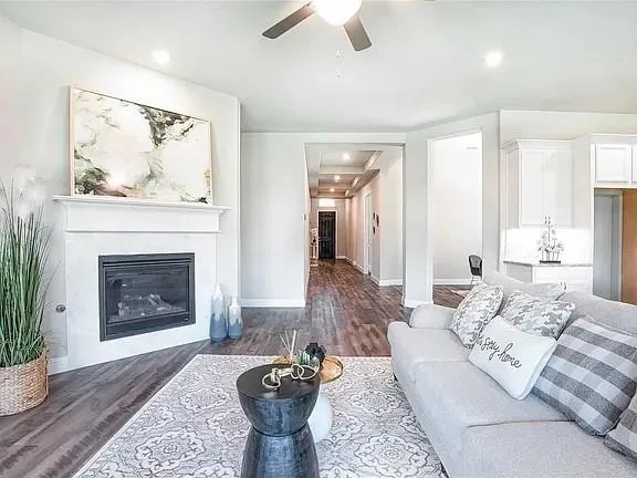 a bathroom with a granite countertop sink and a bathtub