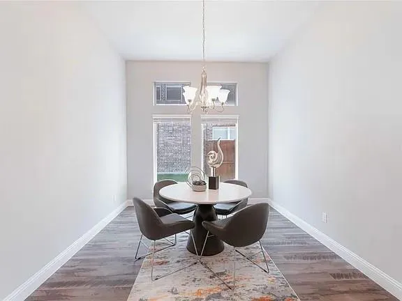 an aerial view of a house with swimming pool and patio