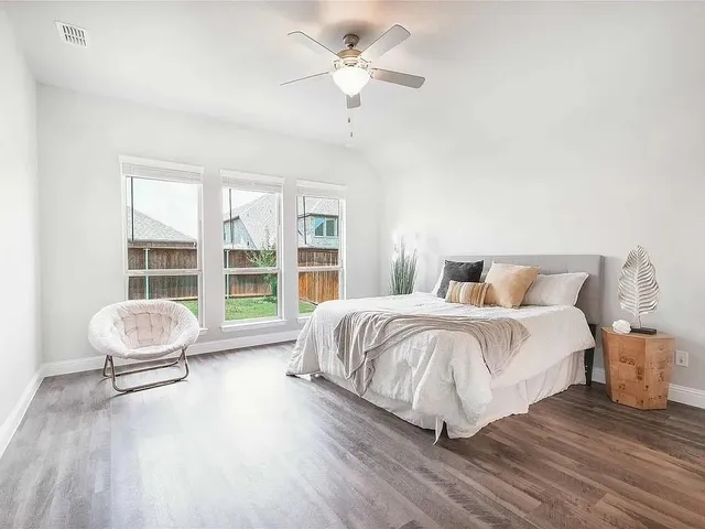 an aerial view of a house with a yard