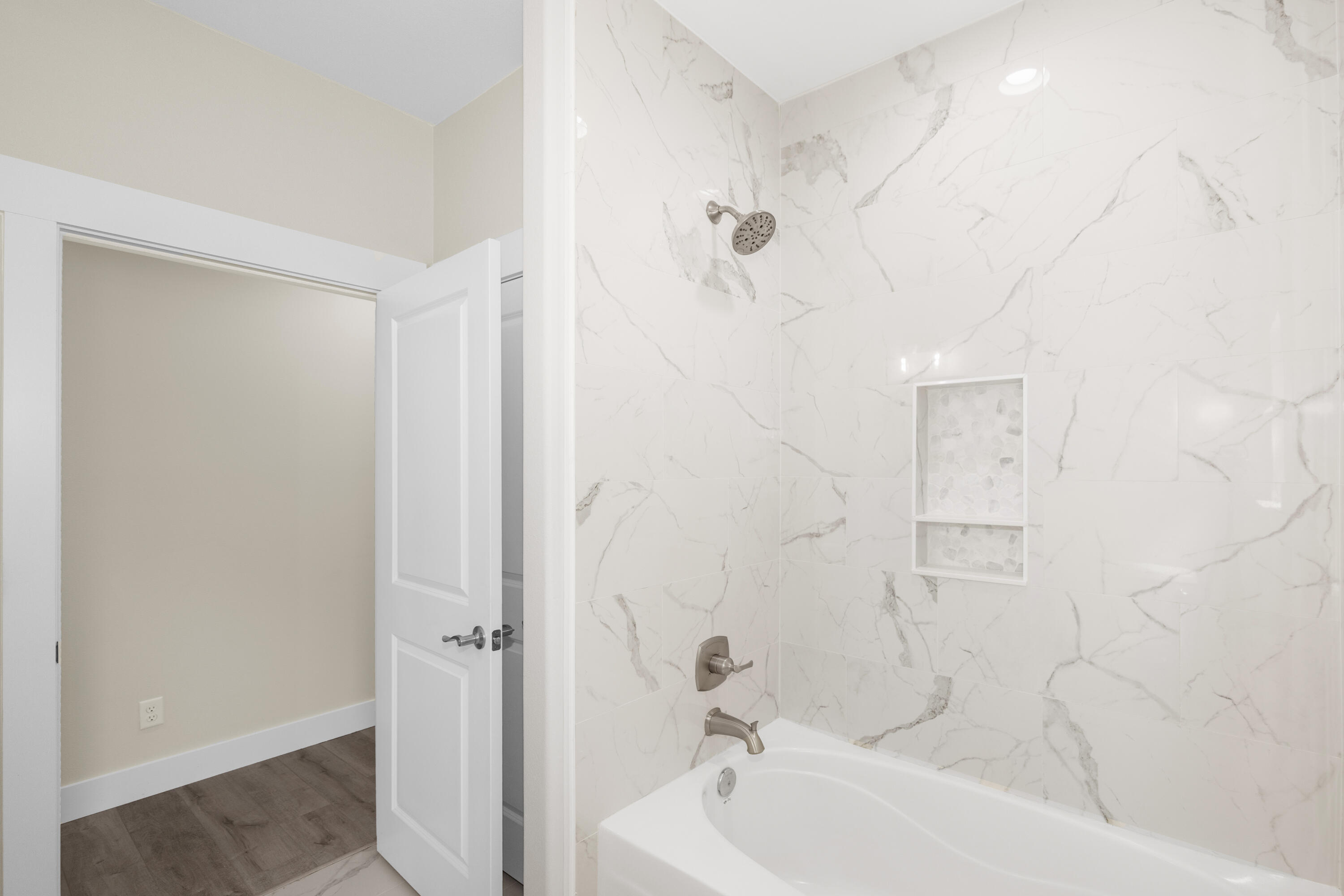 61 Spruce Street Freeport, FL 32439 - Photo 20 of 35 a bathroom with a bathtub and a shower