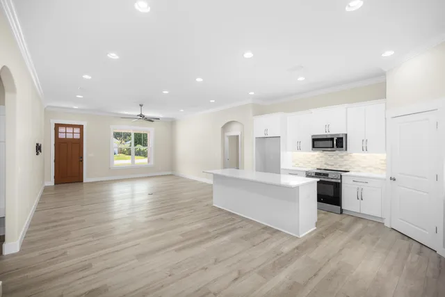 a view of a room with a white walls