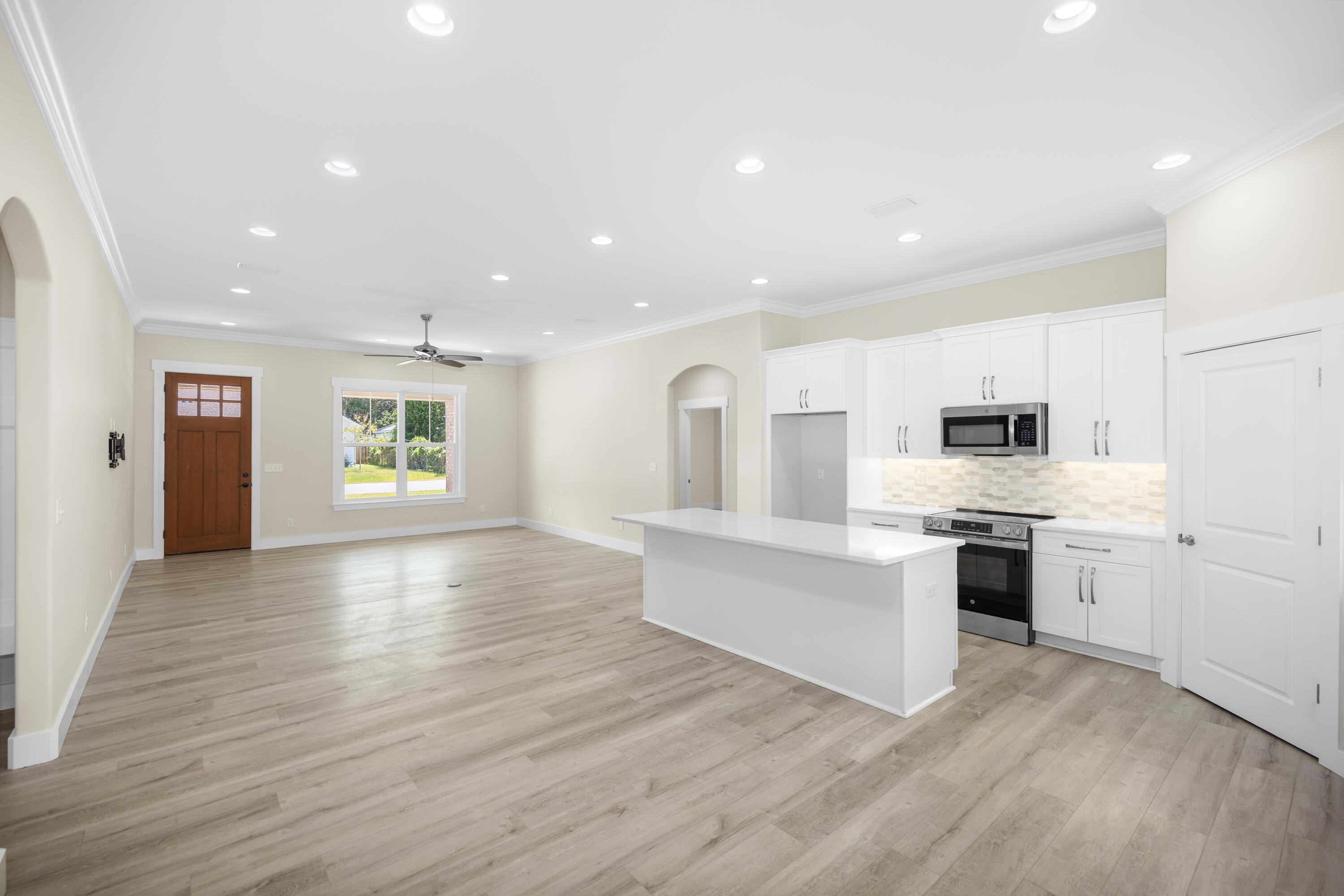 61 Spruce Street Freeport, FL 32439 - Photo 23 of 35 a view of kitchen with cabinets and wooden floor