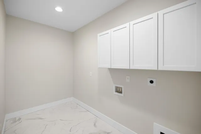 a view of a house with backyard and a tree