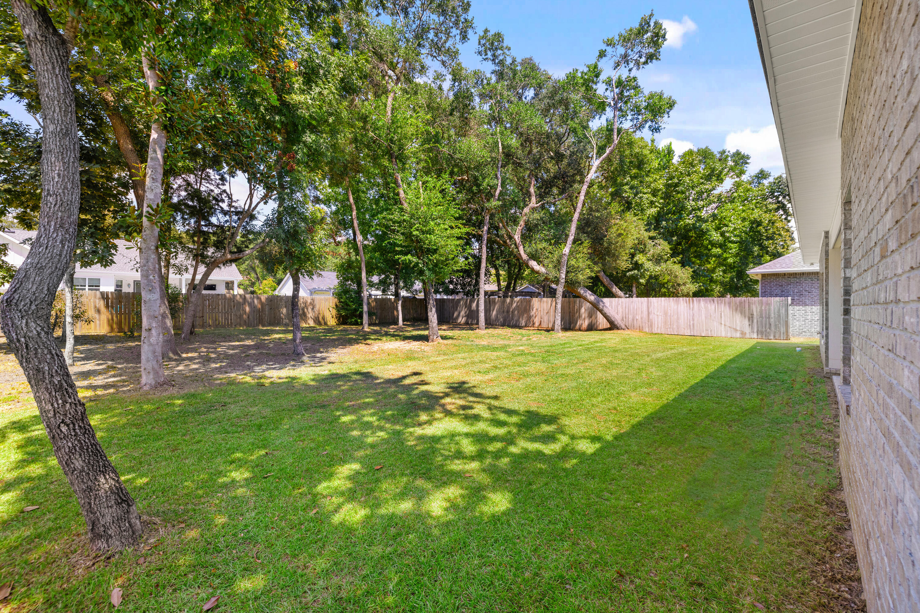 61 Spruce Street Freeport, FL 32439 - Photo 31 of 35 a view of swimming pool with a garden