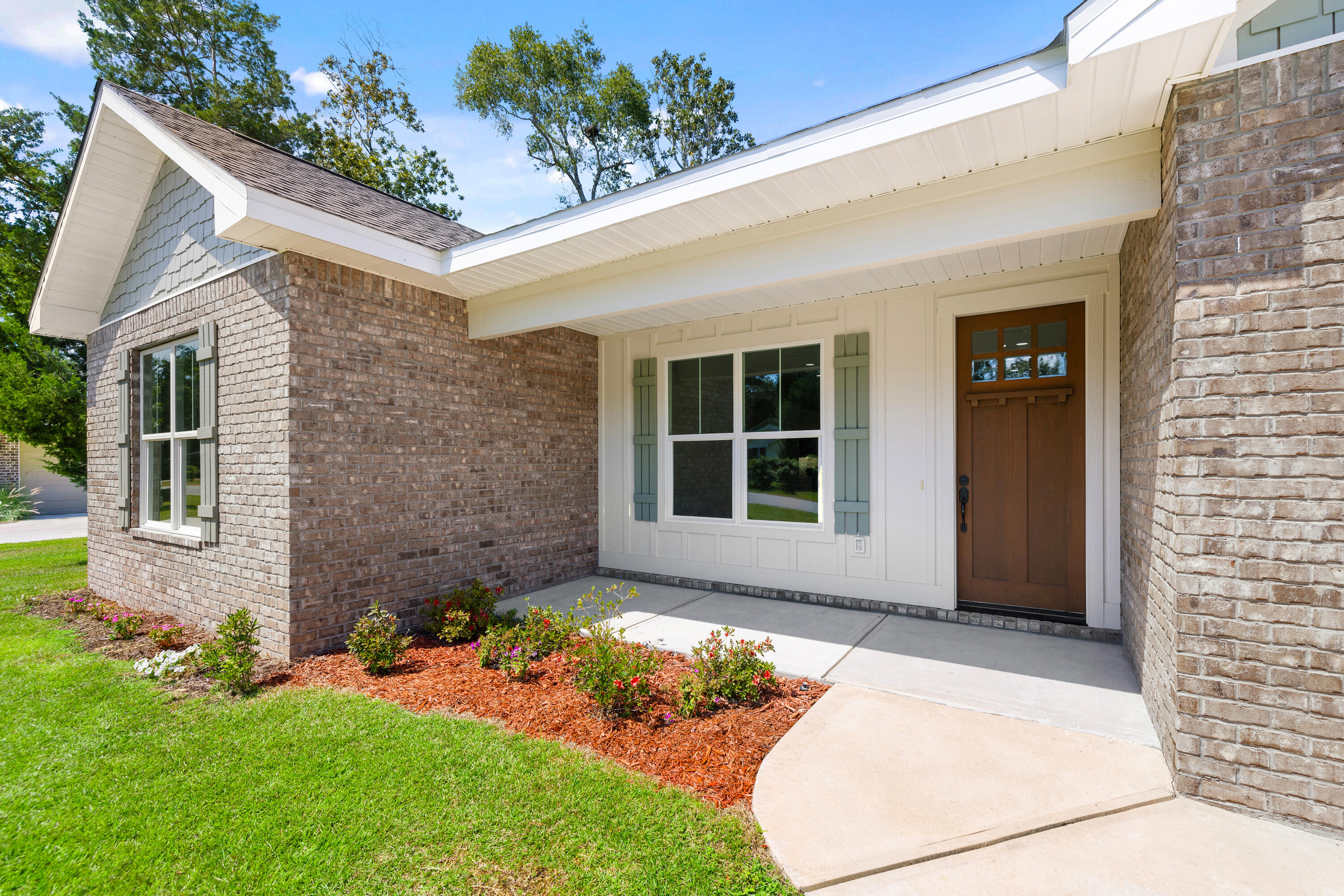 61 Spruce Street Freeport, FL 32439 - Photo 5 of 35 a front view of a house with a yard