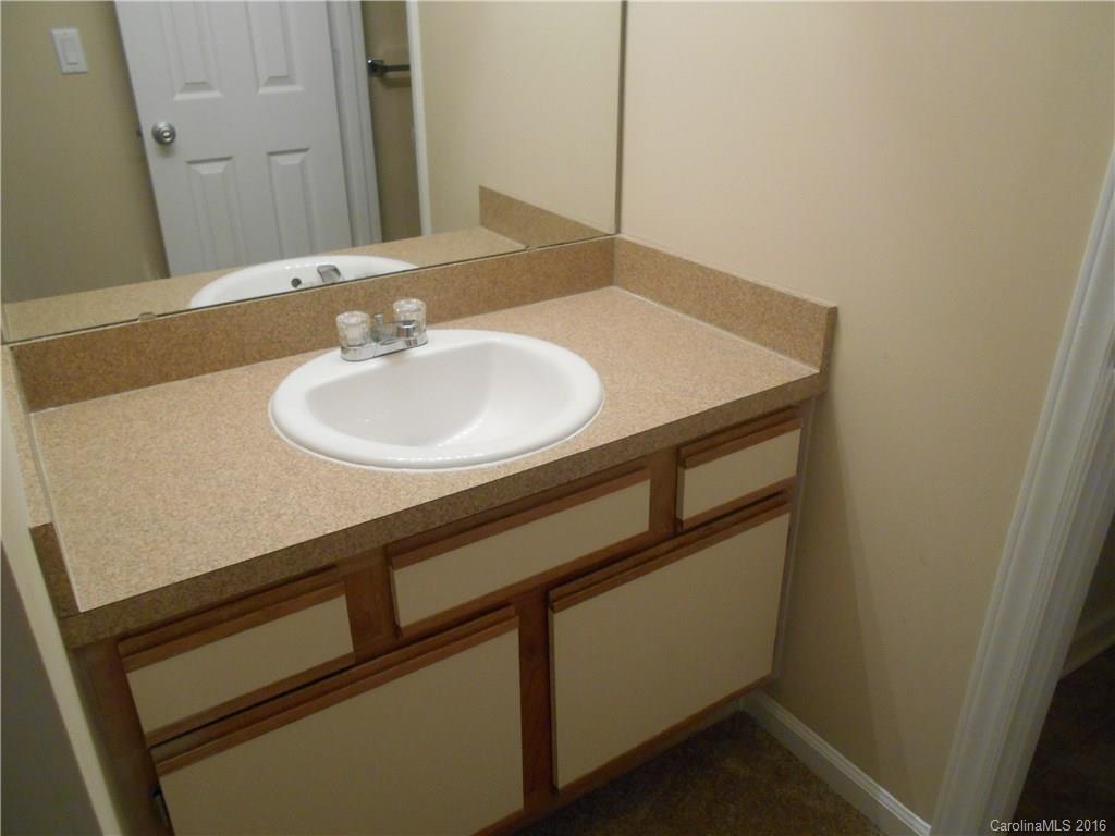6733 Bevington Ridge Road, Unit A & B Charlotte, NC 28277 - Photo 13 of 18 a bathroom with a sink and a mirror