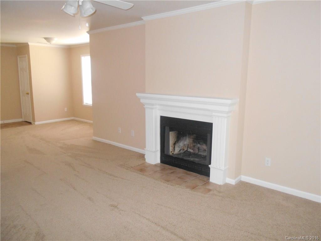 6733 Bevington Ridge Road, Unit A & B Charlotte, NC 28277 - Photo 3 of 18 a view of an empty room with a fireplace