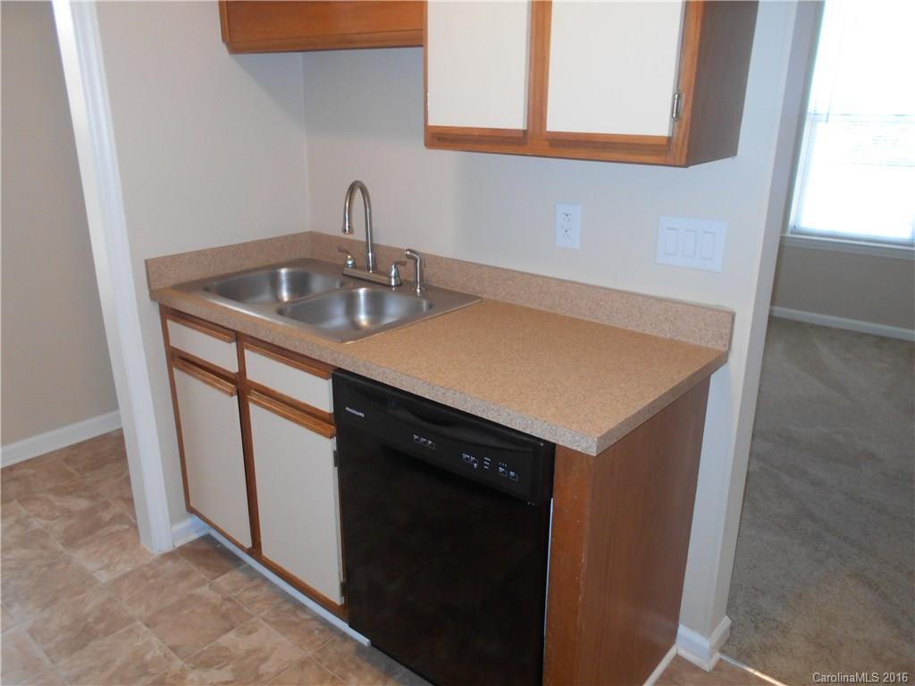 6733 Bevington Ridge Road, Unit A & B Charlotte, NC 28277 - Photo 6 of 18 a kitchen with a sink cabinets and window