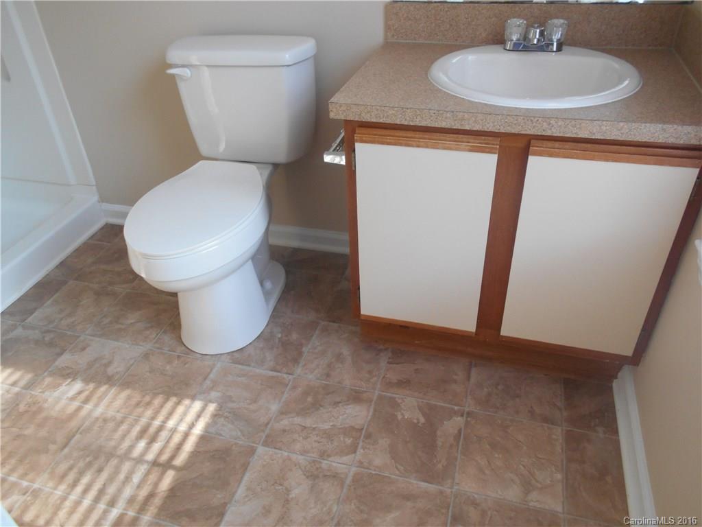 6733 Bevington Ridge Road, Unit A & B Charlotte, NC 28277 - Photo 9 of 18 a bathroom with a toilet and a sink