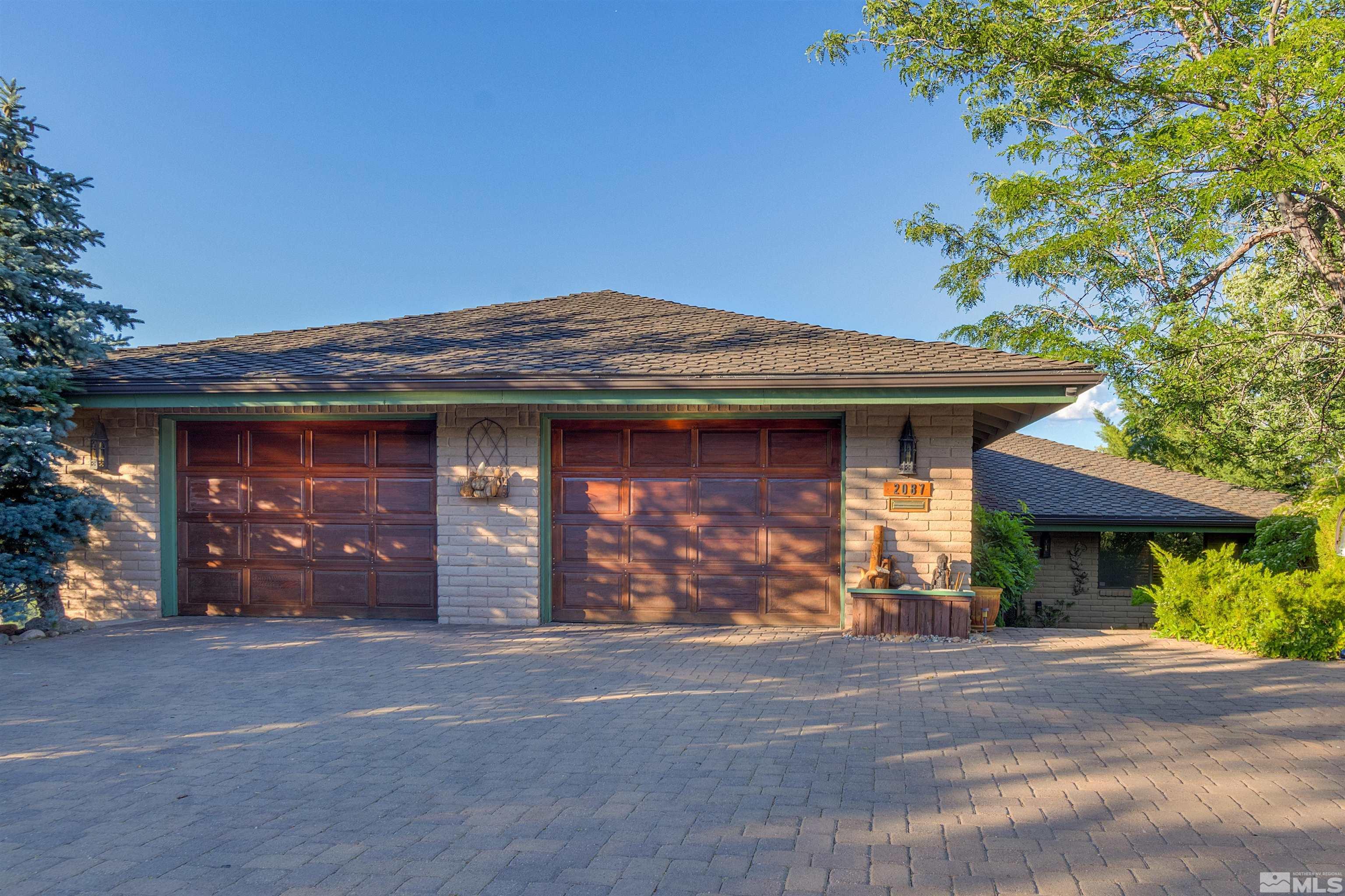 2087 Chanslor Circle Reno, NV 89509 - Photo 1 of 29 a front view of a house with a garden