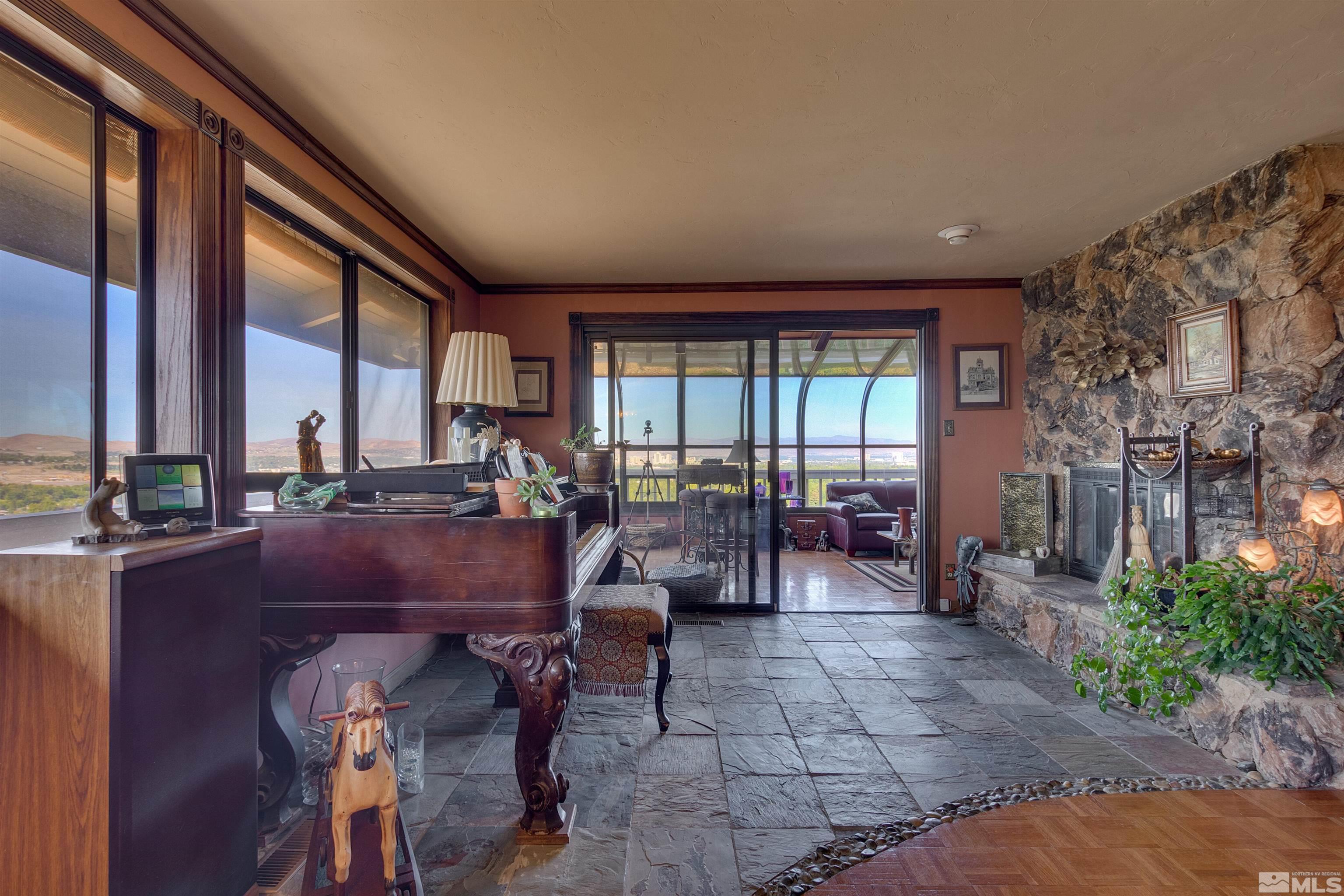 2087 Chanslor Circle Reno, NV 89509 - Photo 11 of 29 a view of a dining room with furniture and floor to ceiling window
