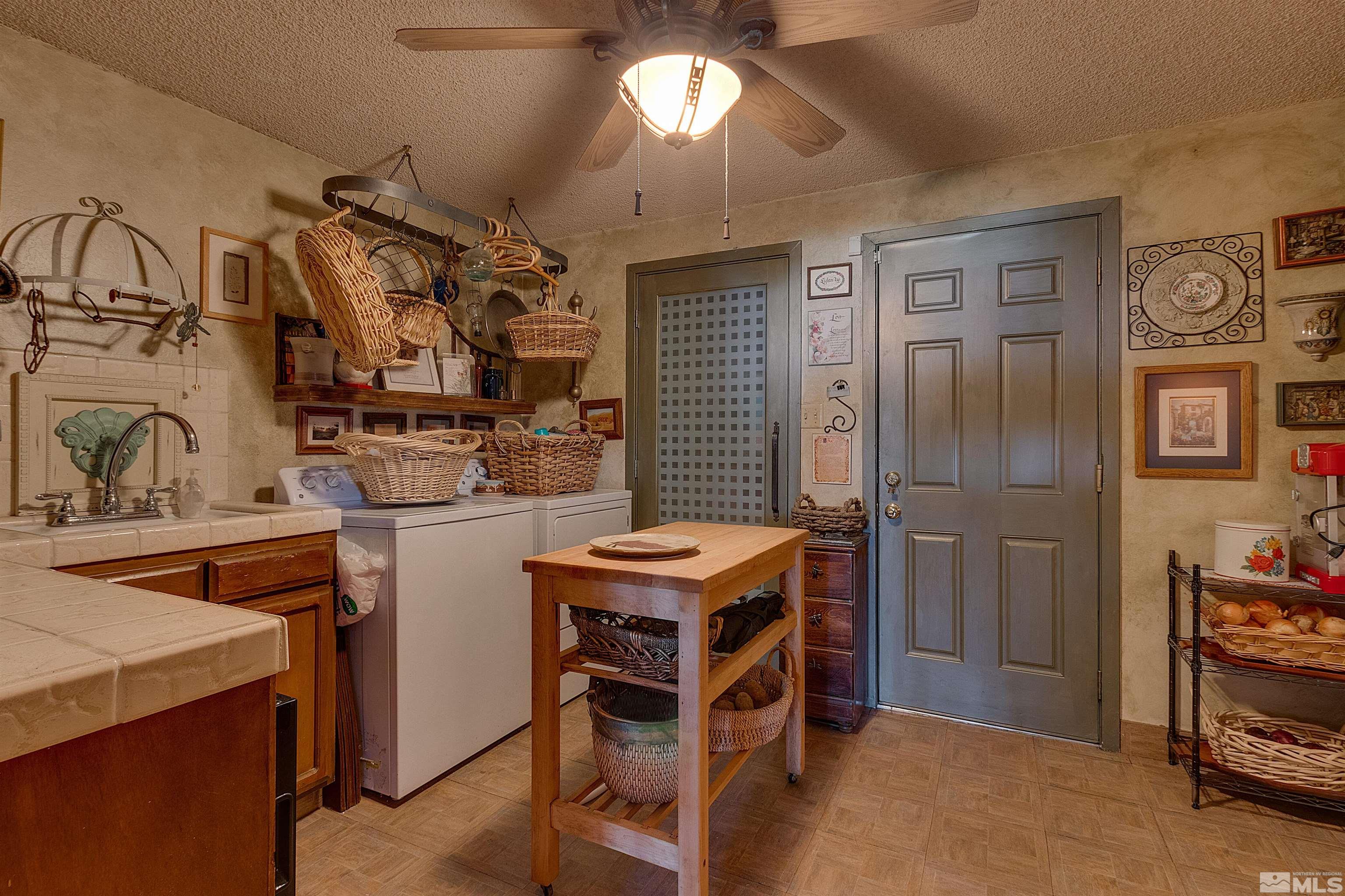 2087 Chanslor Circle Reno, NV 89509 - Photo 19 of 29 a utility room with dryer and washer