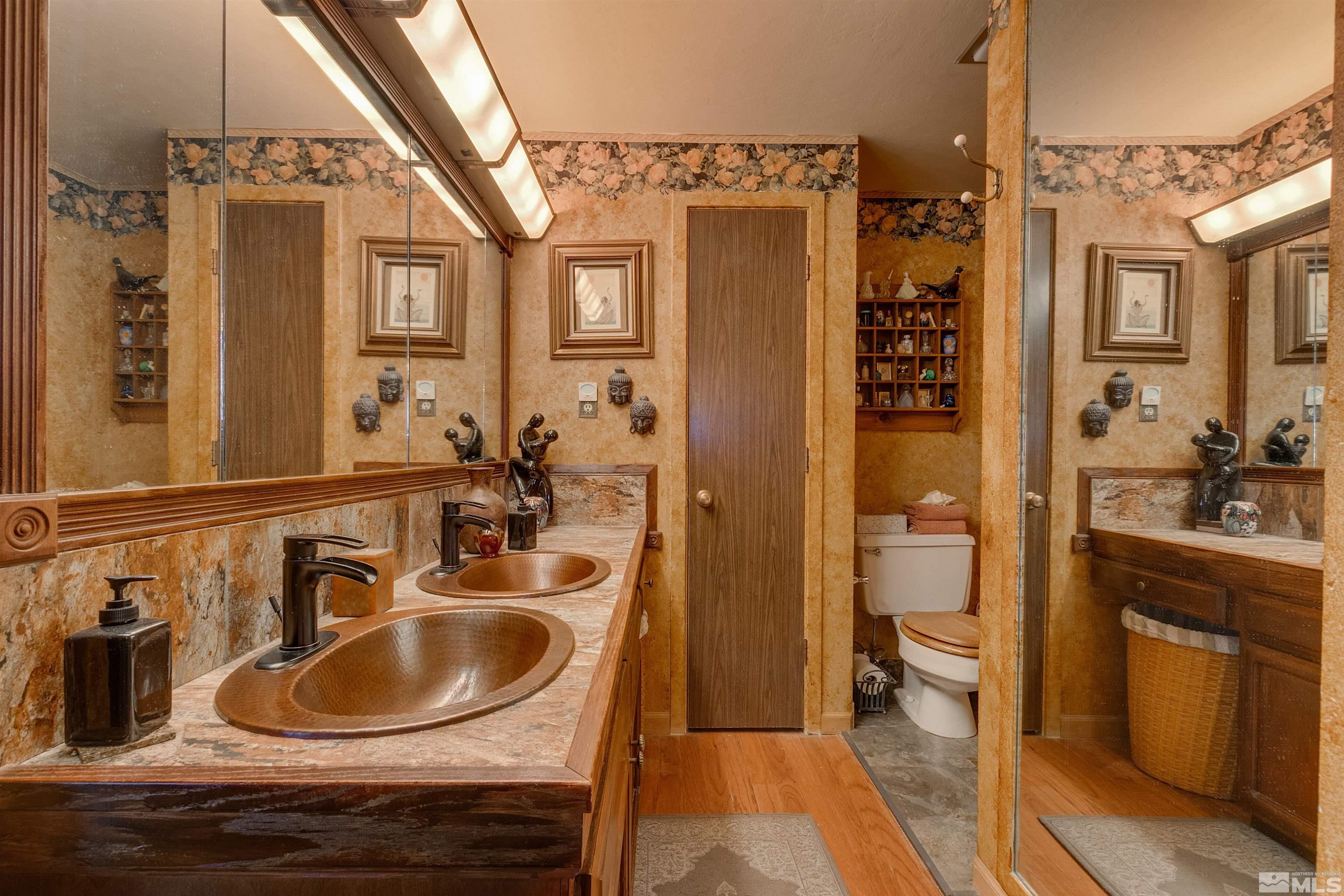 2087 Chanslor Circle Reno, NV 89509 - Photo 23 of 29 a bathroom with a sink and a mirror
