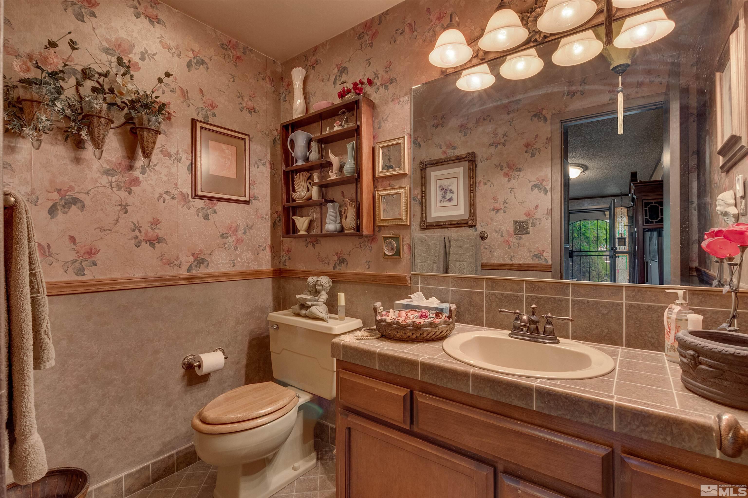 2087 Chanslor Circle Reno, NV 89509 - Photo 24 of 29 a bathroom with a sink toilet and mirror