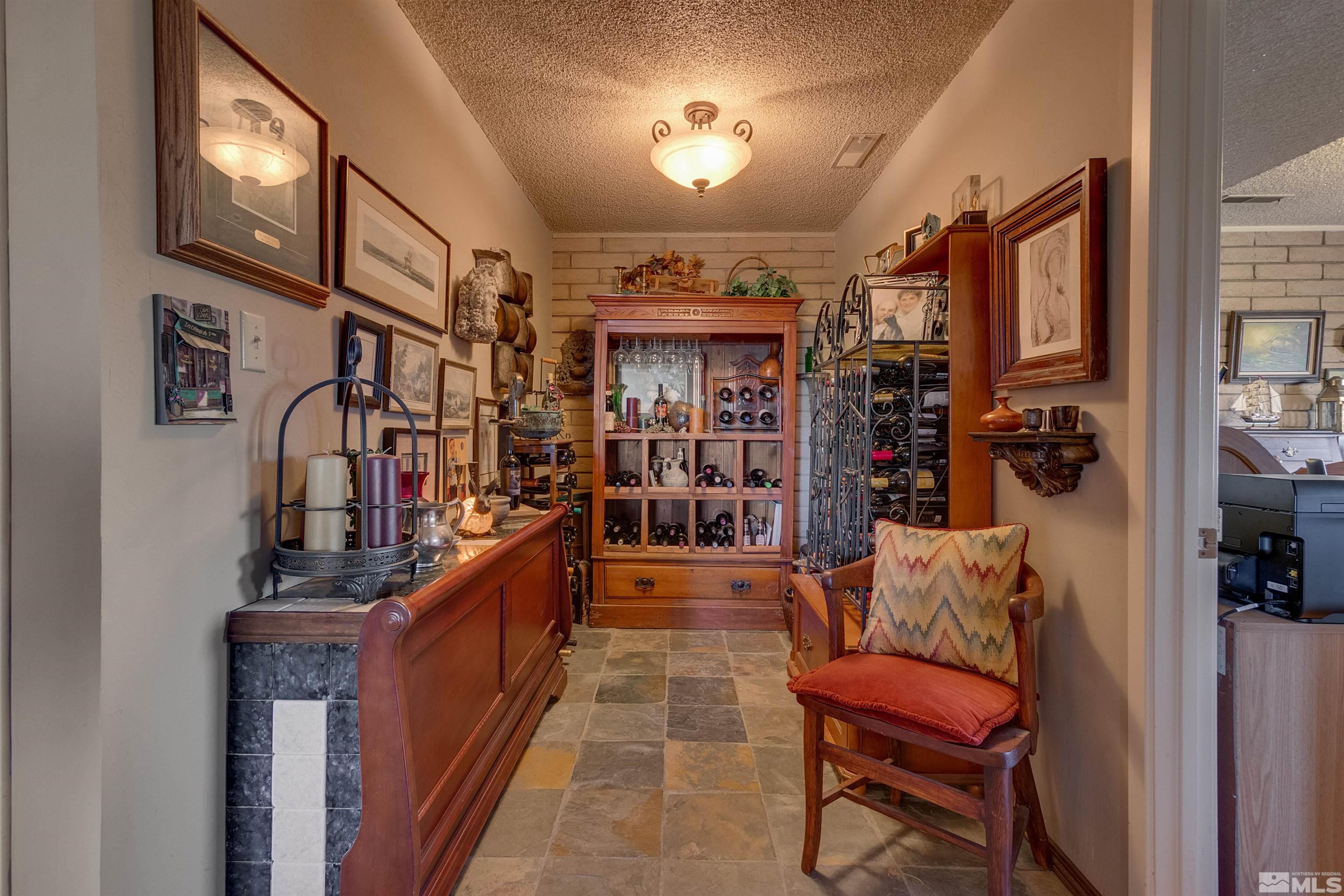 2087 Chanslor Circle Reno, NV 89509 - Photo 25 of 29 a hallway with a couch and chandelier