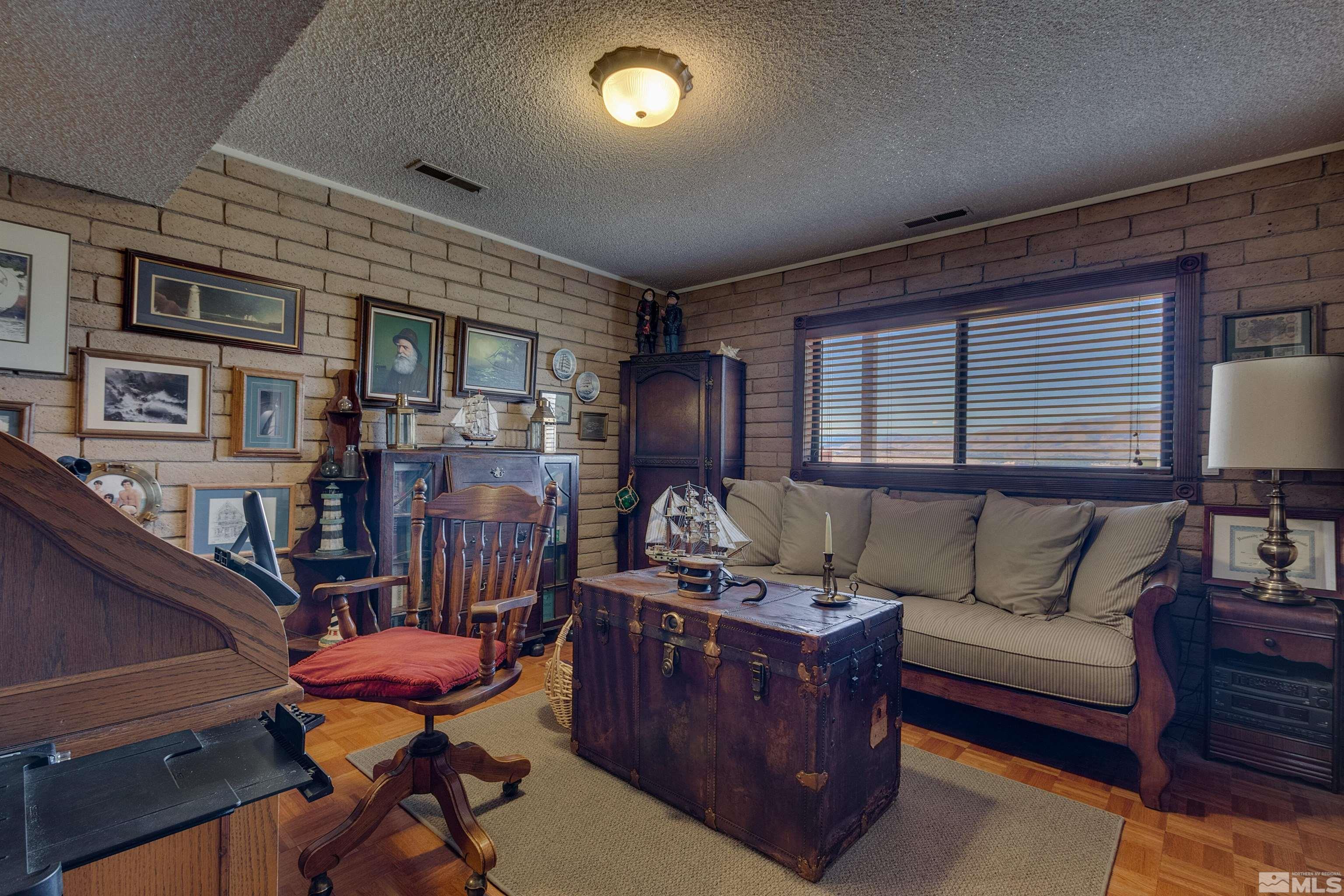 2087 Chanslor Circle Reno, NV 89509 - Photo 26 of 29 a living room with furniture a air conditioner vent and a window