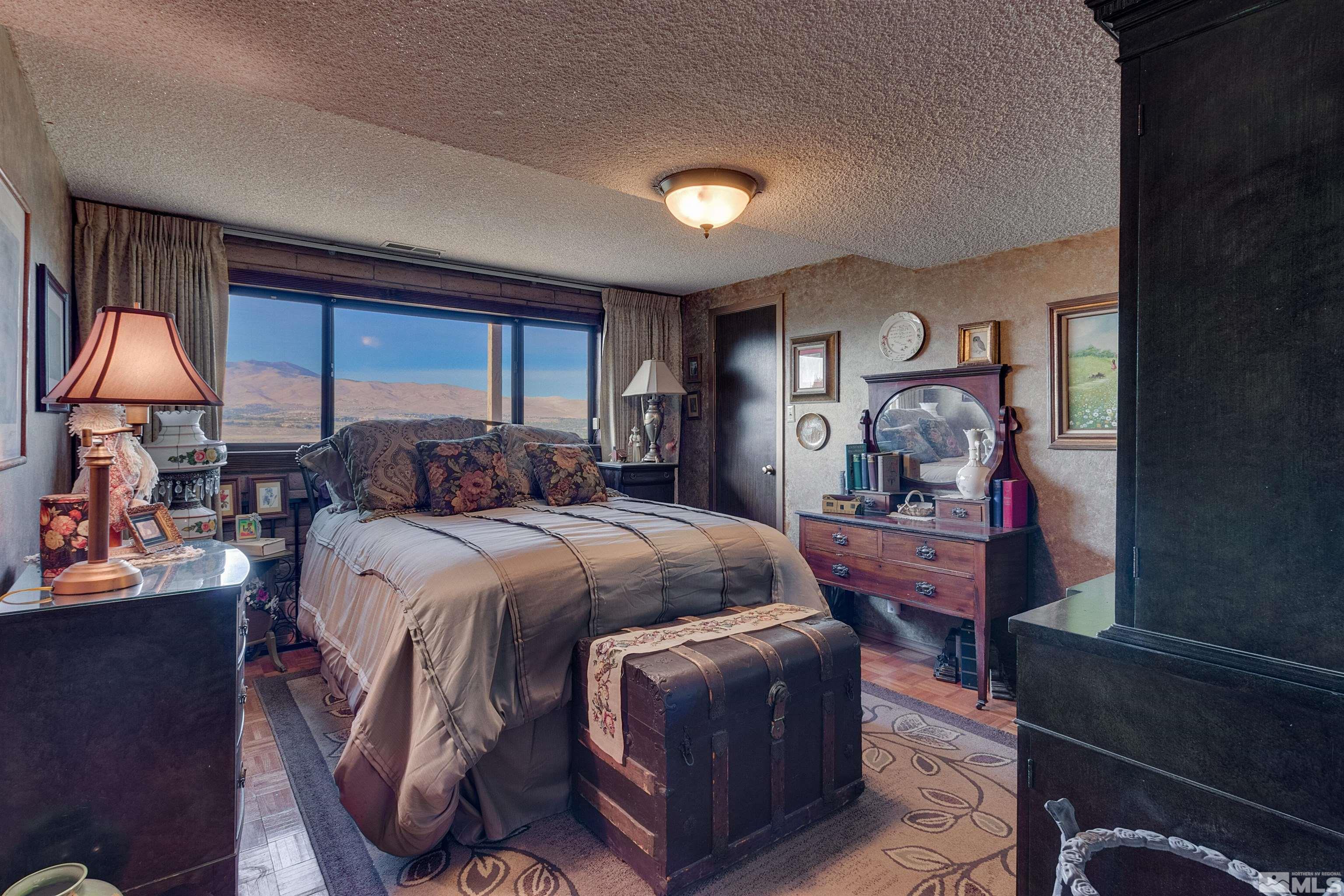 2087 Chanslor Circle Reno, NV 89509 - Photo 27 of 29 a bedroom with a bed and a closet